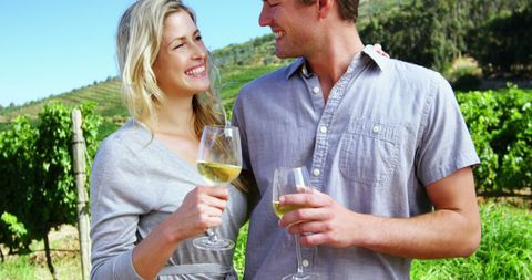 Happy Couple Enjoying Wine Tasting at Vineyard - Download Free Stock Images Pikwizard.com