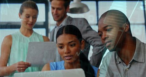 Diverse Team Collaborating on Financial Data Analysis with Technology Overlay