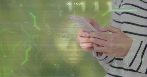 Woman with smartphone amidst digital circuitry