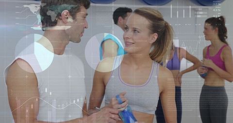 Individuals Discussing Fitness Goals in Modern Gym Environment