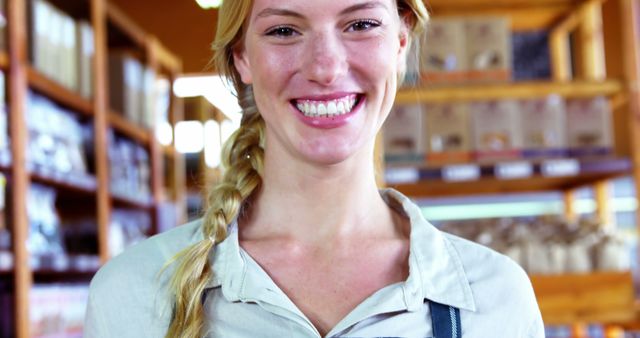 Smiling Female Worker in Grocery Store - Download Free Stock Images Pikwizard.com