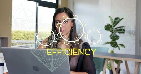 South asian professional typing on laptop in coworking space with efficiency overlays