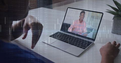 Watching remote presenter on laptop delivering analytics with data overlay for virtual collaboration