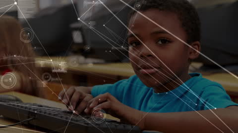 Young African American Student Engaging with Computer Technology