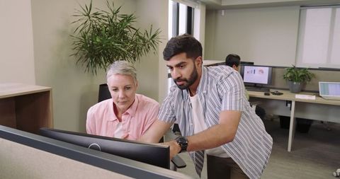 Work collaboration in modern office with technology and greenery