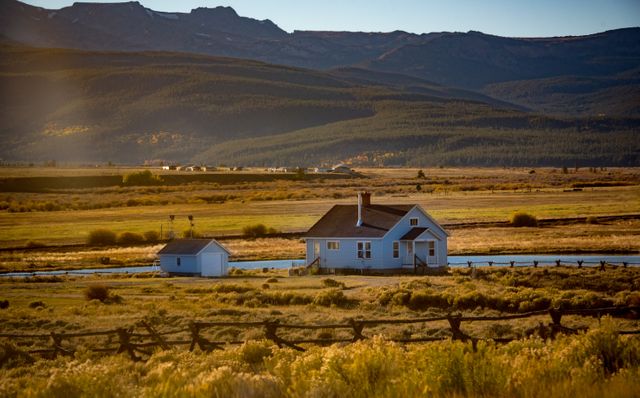 Rural Countryside Landscape with House by River and Mountain Background - Download Free Stock Photos Pikwizard.com