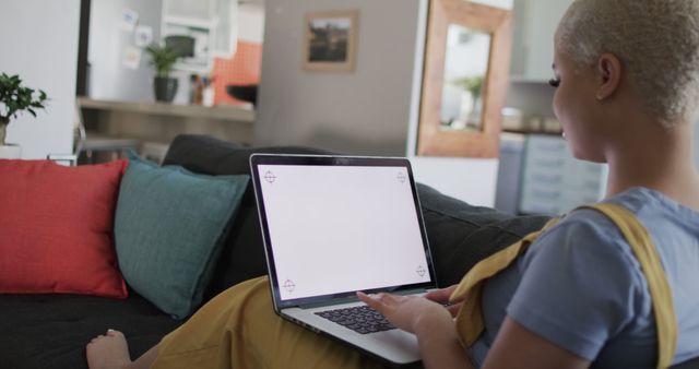 Woman Relaxing on Couch Using Laptop at Home - Download Free Stock Images Pikwizard.com