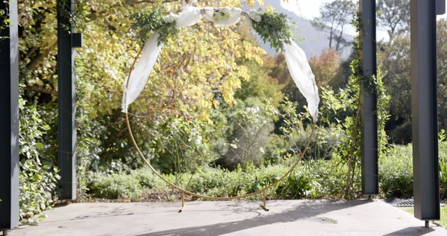 Elegant Circular Wedding Arch Decorated with Greenery and White Fabric Outdoors - Download Free Stock Images Pikwizard.com