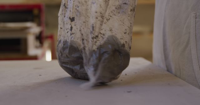 Compressed Bag of Wet Clay Hitting Table Surface - Download Free Stock Images Pikwizard.com