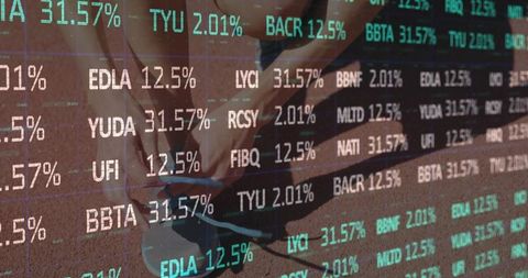 Crouching runner tying grey-blue running shoes on red track with financial ticker overlay