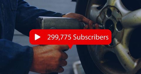 Mechanic tightening lug nut with impact wrench on alloy wheel with subscriber overlay