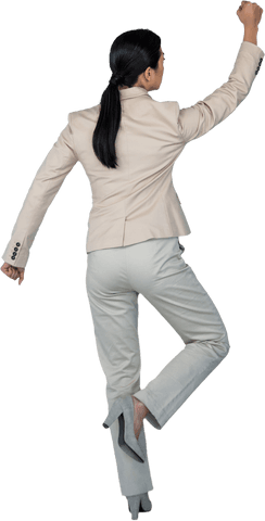 Transparent Businesswoman in Suit Writing on Wall Rear View