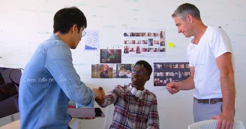 Diverse Team Collaborating in Modern Office with Digital Data Interfaces