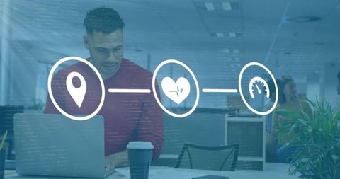 Casual Businessman Using Laptop in Office with Digital Media Icons