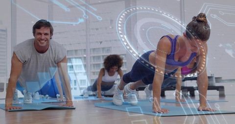 Group performing plank workout with augmented reality fitness overlays