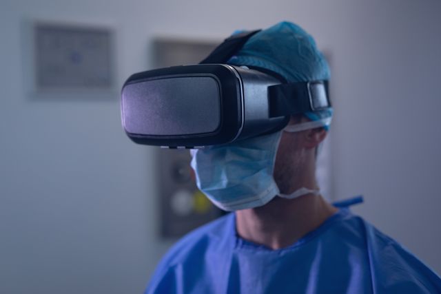 Surgeon wearing virtual reality headset in an operating room demonstrates the integration of advanced technology in modern medicine. Ideal for illustrating topics related to medical innovation, healthcare advancements, and the future of surgical procedures. Suitable for use in medical publications, technology articles, and educational materials about the use of VR in the medical field.