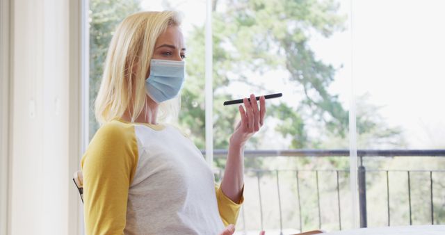 Woman Wearing Mask Using Smartphone for Voice Command - Download Free Stock Images Pikwizard.com