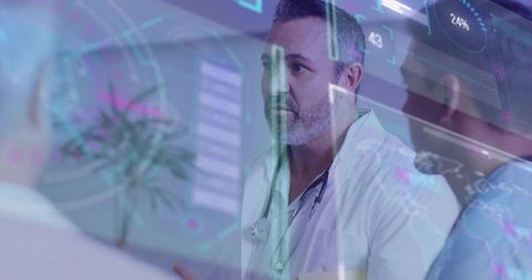 Bearded clinician explaining care plan with augmented reality HUD in clinic consultation