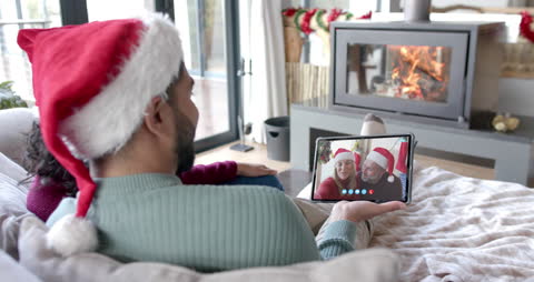 Diverse Couples Video Calling Relatives during Christmas