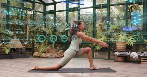 Woman Practicing Lunge Yoga in Glass Greenhouse with Augmented Reality Fitness Overlays
