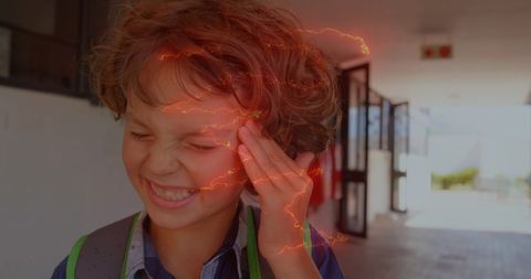 Caucasian boy with headache illustrates mental health concept