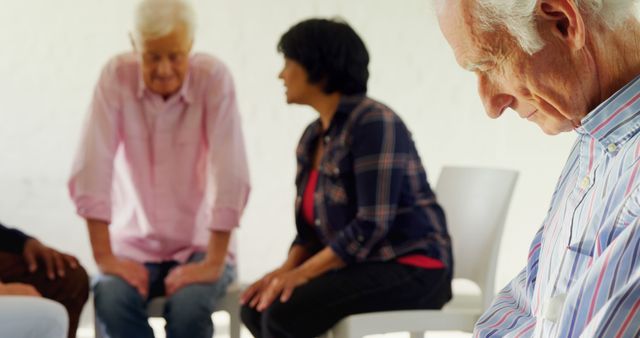 Senior Group Therapy Session with Diverse Participants in Focused Interaction - Download Free Stock Images Pikwizard.com