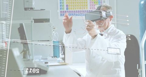 Senior scientist wearing vr headset manipulating holographic hud in laboratory workbench