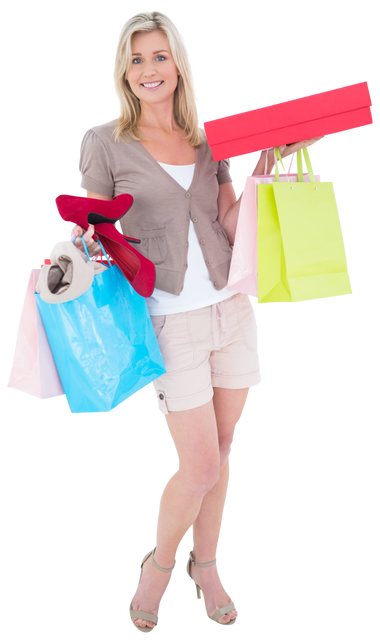 Happy Blonde Holding Colorful Shopping Bags and Christmas Gift Boxes on Transparent Background - Download Free Stock Videos Pikwizard.com