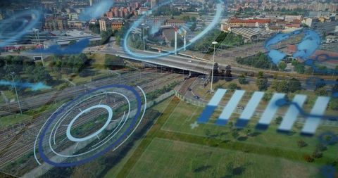 Aerial railway junction showing futuristic hud overlay over urban transit corridor