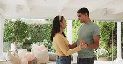 Joyful Romantic Couple Dancing at Home Celebration