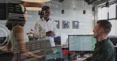 Diverse Team Discussing Data Analytics in Modern Office Environment