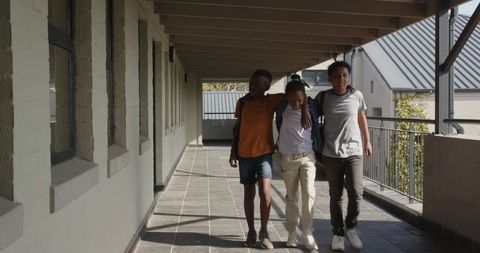 Diverse Friends Walking School Corridor Outdoors