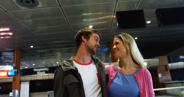 Smiling Couple Enjoying Moment at Modern Airport Terminal - Download Free Stock Images Pikwizard.com