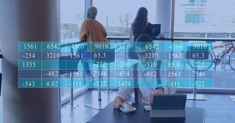 Businessman Analyzing Data on Tablet Overlaid with Digital Metrics