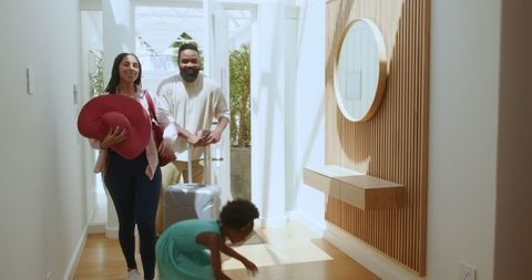 Family arriving in holiday apartment enjoying vacation together