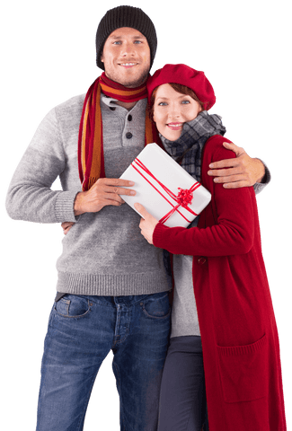 Happy Couple Holding Gift in Winter Attire Transparent Background