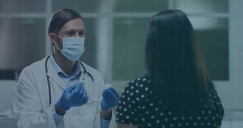 Doctor administering injection to patient in medical clinic office