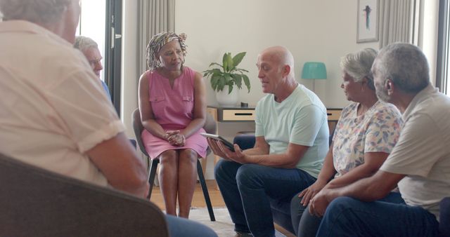 Diverse senior group having discussion in living room - Download Free Stock Images Pikwizard.com