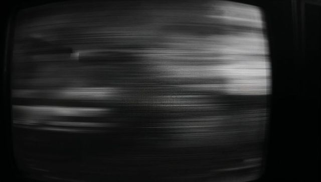 Glitchy Retro CRT Screen with Monochrome Digital Noise Pattern