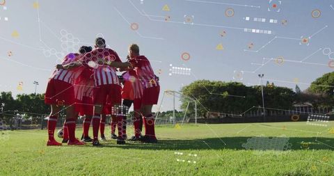 Soccer team huddling on field depicted with data particles overlay