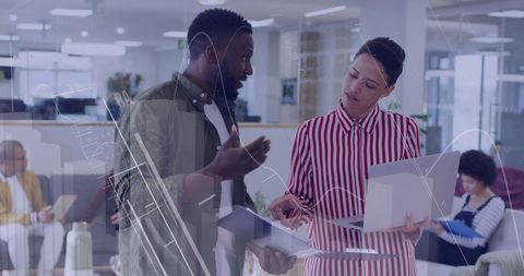 Business professionals collaborating in modern office with digital data overlay