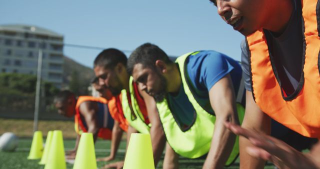 Young Athletes in Team Jerseys Training with Cones on Grass Field - Download Free Stock Images Pikwizard.com