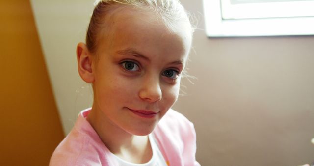 Smiling Young Girl in Pink Sweater with Bright Eyes - Download Free Stock Images Pikwizard.com