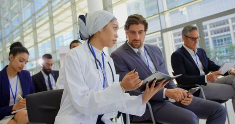 Diverse Professionals Collaborating at Business Seminar