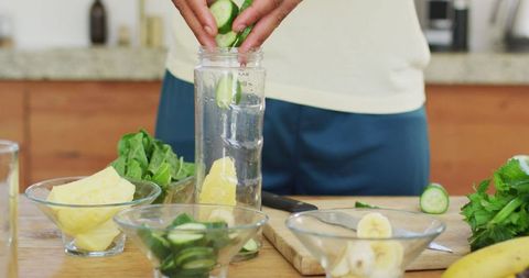 Healthy Smoothie Preparation by African American Man