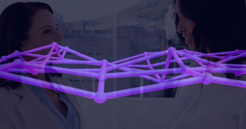 Two Businesswomen Collaborating with Purple Network Graph Overlay in Modern Office Space