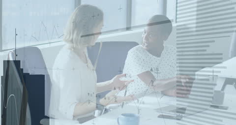 Business Colleagues Discussing Finances with Digital Graph Overlay