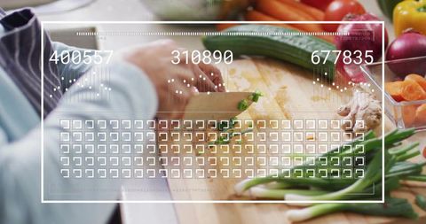 Hands chopping scallions on wooden board with augmented reality HUD for smart kitchen
