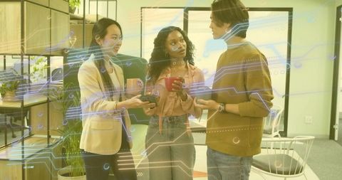 Team collaborating with modern technology interface in office lounge