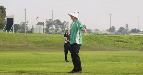 Referees observing action on sports field